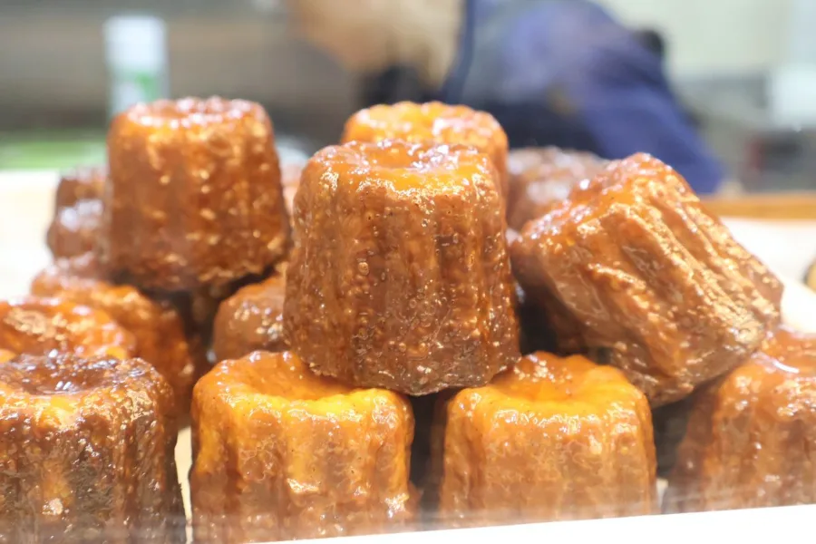 Dark caramelised canel&eacute;s stacked in the Petite Krumbs display tray